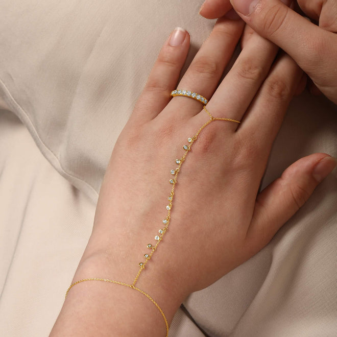 Bezel Diamond Scatter Hand Chain in 14kt yellow gold worn on hand, natural diamonds