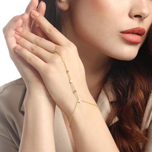 Clover and Diamond Hand Chain in 14kt yellow gold worn on hand, pavé clover natural diamonds