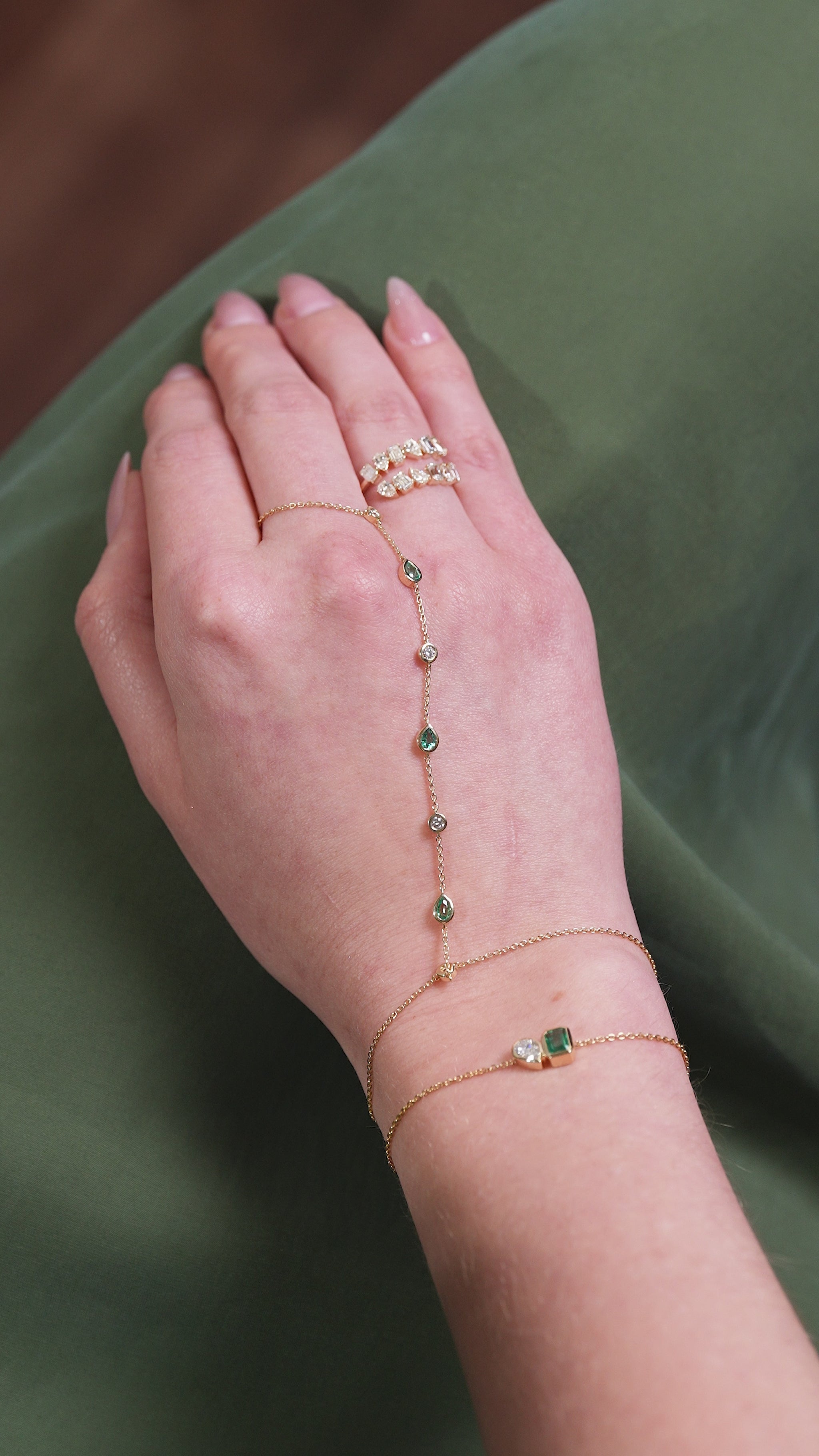 Video  of Emerald and Diamond Hand Chain in 14kt yellow gold worn on hand