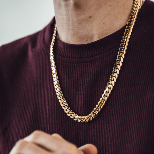 gold 10mm miami cuban link chain on red shirt