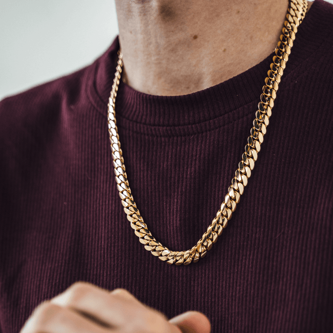 gold 10mm miami cuban link chain on red shirt